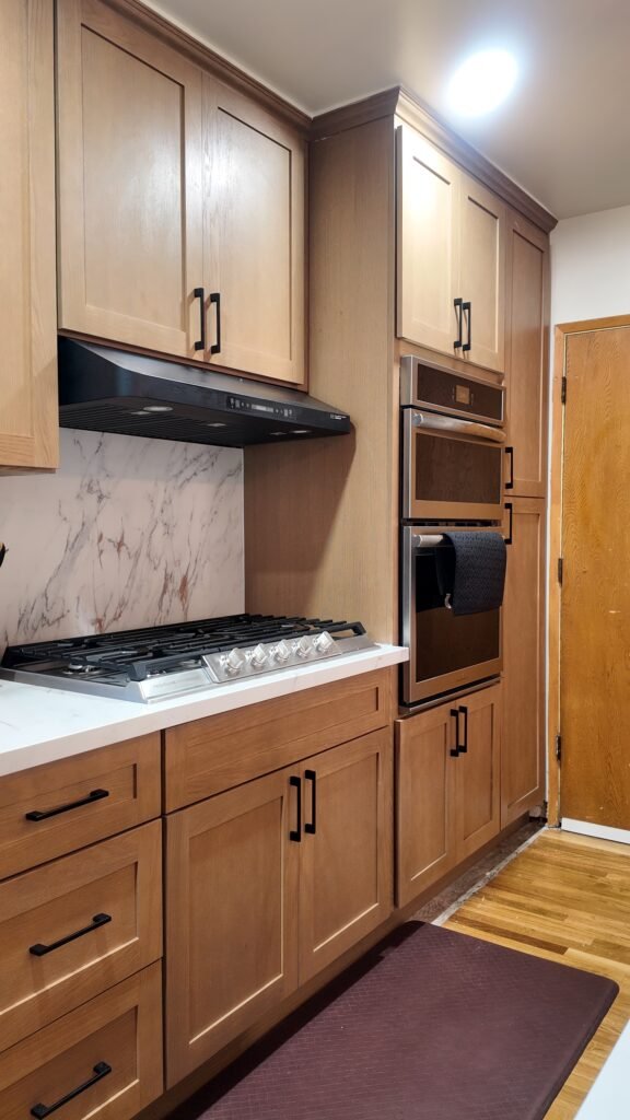 Contemporary La Habra kitchen renovation with quartz countertops and new lighting